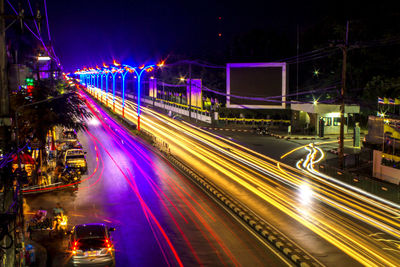 Light trails on city street at night