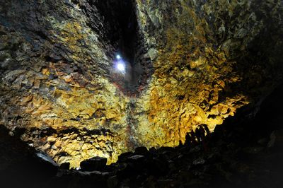 Low angle view of illuminated rock formation at night