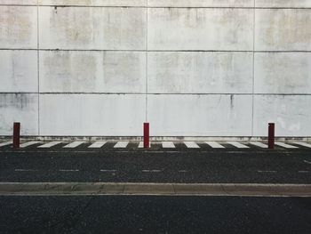 Empty road against wall