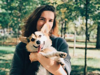 Portrait of young woman with dog