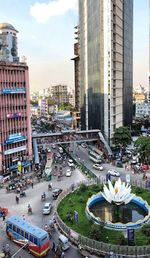 High angle view of city street and buildings against sky