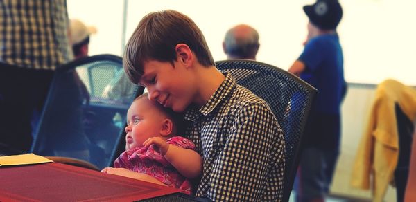 Close-up of boy holding baby