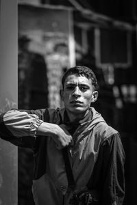 Portrait of young man standing outdoors