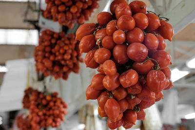 Bunch of tomatoes displayed at market stall