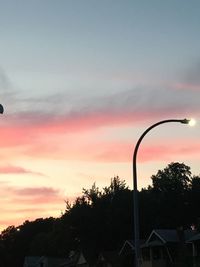 Silhouette trees against sky during sunset