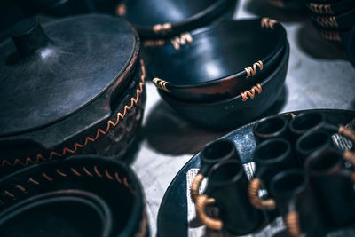 High angle view of ceramic containers on table