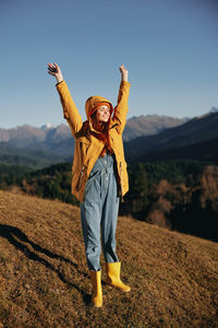 Full length of woman standing on field