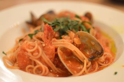 Close-up of spaghetti pasta with clams served in bowl