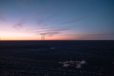 Scenic view of silhouette land against sky during sunset