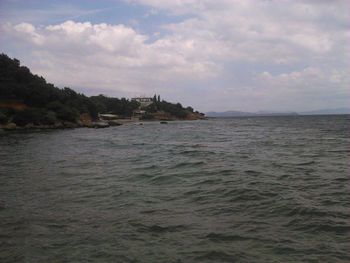 Scenic view of sea against cloudy sky