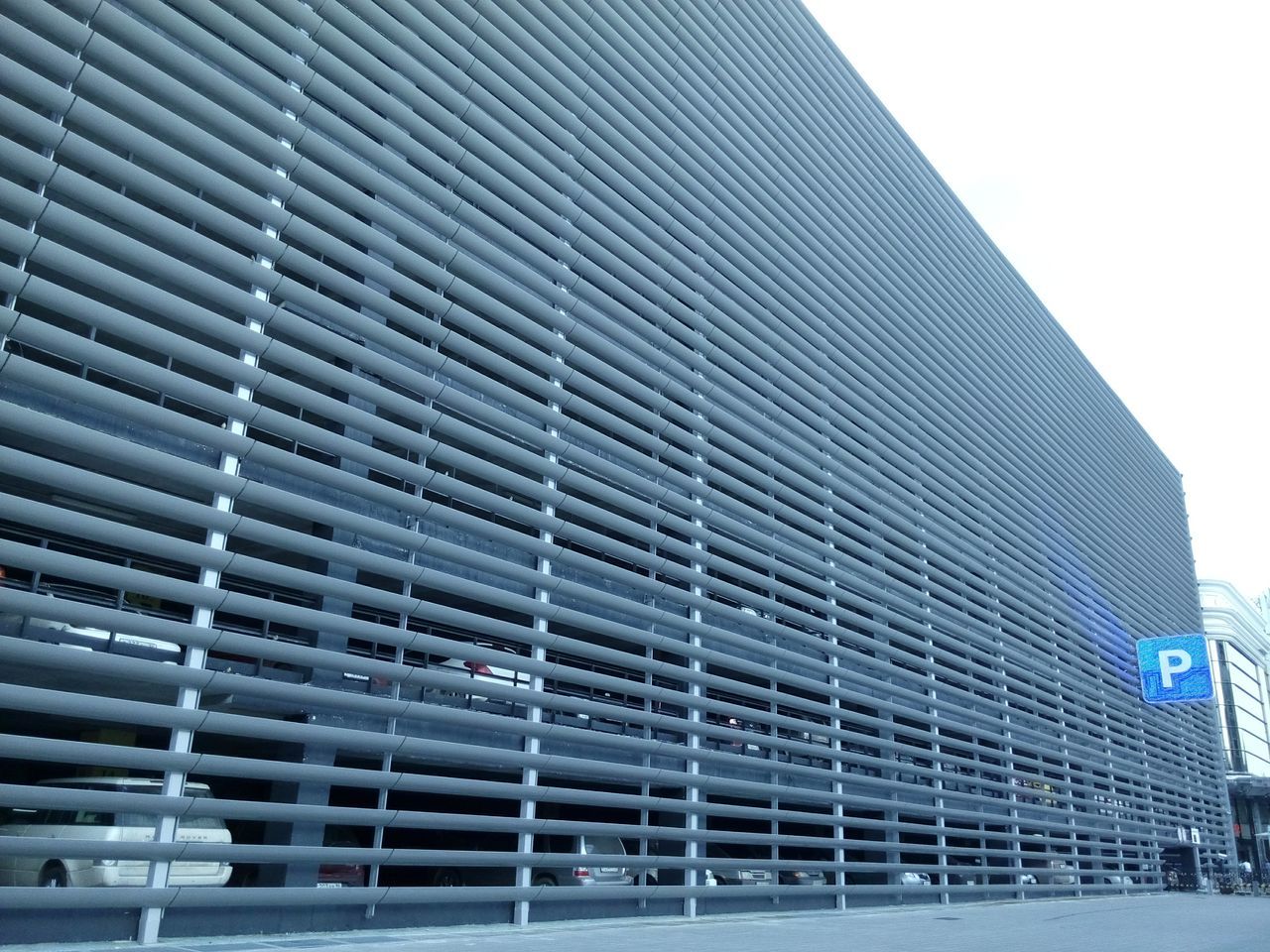 building exterior, architecture, built structure, low angle view, building, modern, city, window, office building, glass - material, pattern, reflection, outdoors, day, no people, sky, brick wall, exterior, skyscraper, sunlight