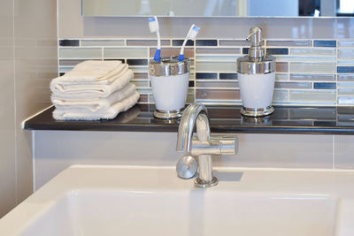 Close-up of faucet in bathroom