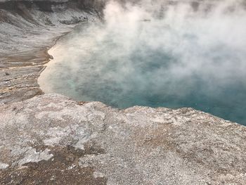 Scenic view of hot spring in volcanic landscape