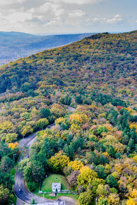 High angle view of trees and lake against sky