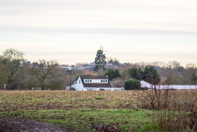 Built structure on landscape against sky