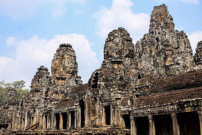 Low angle view of old temple building against sky