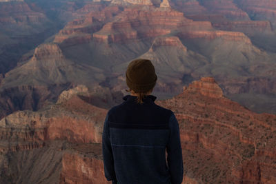 Rear view of man looking at mountains