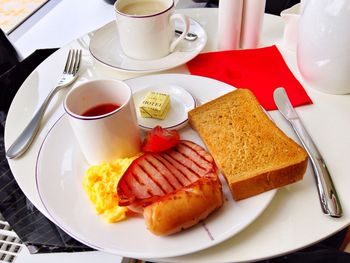 High angle view of english breakfast served with coffee in restaurant