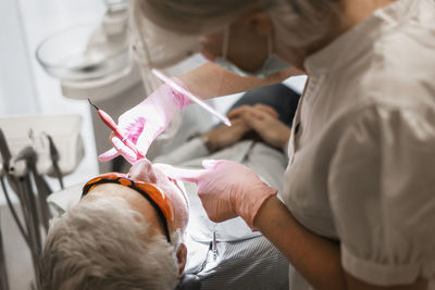 Dentist examining patients teeth