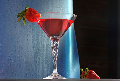 Close-up of red berries in glass