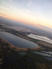 High angle view of city at sunset