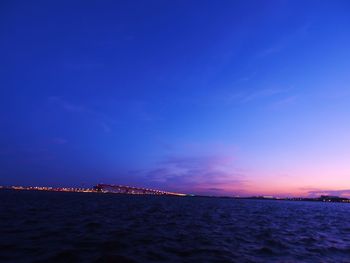 Scenic view of sea against sky at night