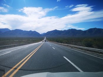 Empty road against sky