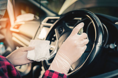 Close-up of hand holding car