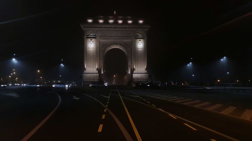 Illuminated railroad station at night