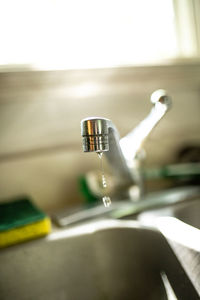 Close-up of faucet in water