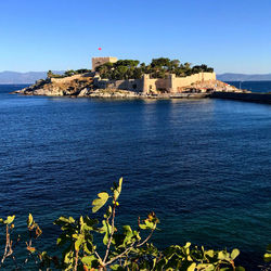 Scenic view of sea against clear blue sky