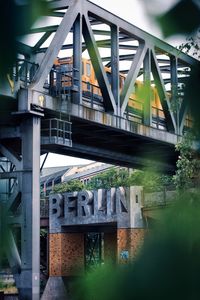 Bridge over river by building