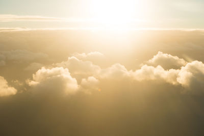 Sunlight streaming through clouds in sky