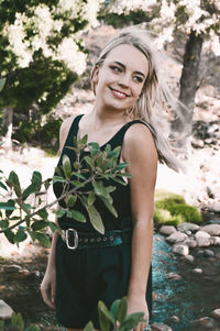 Portrait of woman against plants