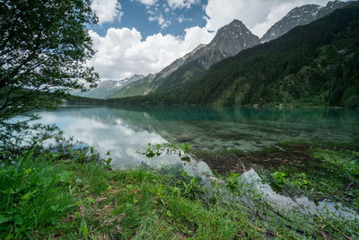 Scenic view of lake and mountains against sky