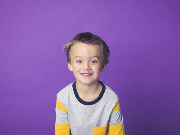 Boy against purple background