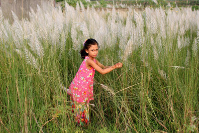Full length of girl on grassy field