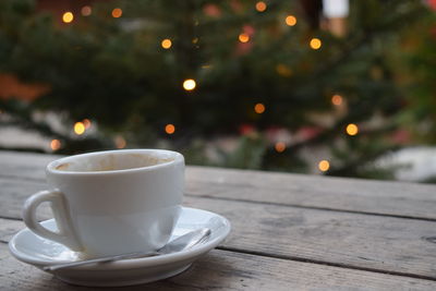 Close-up of coffee cup on table