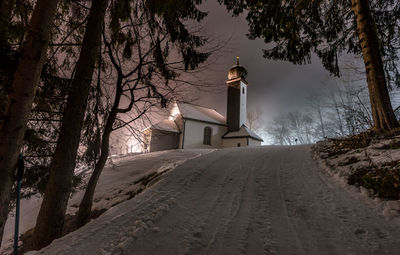 Lighthouse against sky during winter