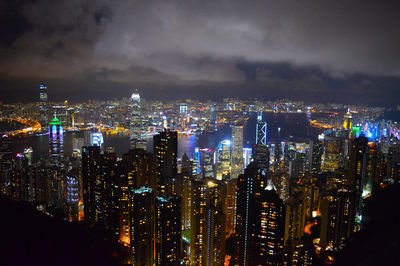 Aerial view of city lit up at night