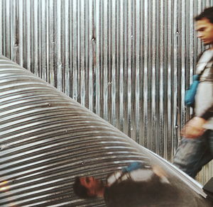 High angle view of man standing by railing