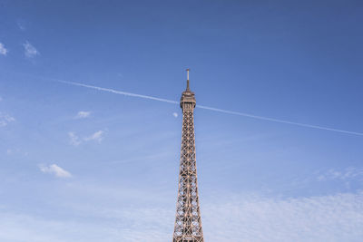 Low angle view of eiffel tower against blue sky