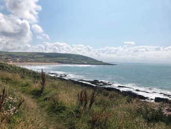 Scenic view of beach against sky