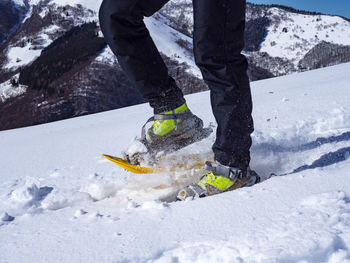 Close-up of snowshoeing activity in the italian alps