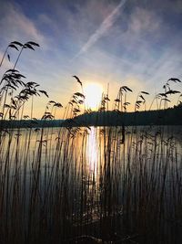 Scenic view of lake against sky during sunset