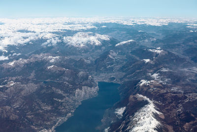 Lake garda and alps view from above . aerial view of snowy mountain an lake . largest lake in italy