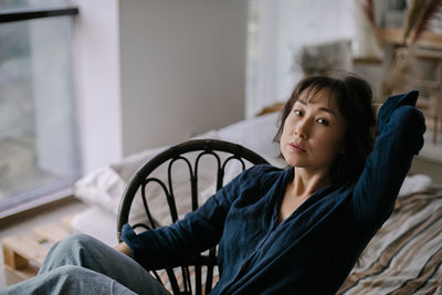 Portrait of woman relaxing at home