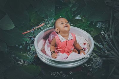 Portrait of a smiling young woman in water