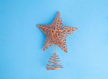 Directly above shot of christmas decoration over colored background