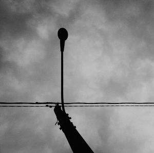 Low angle view of street light against sky